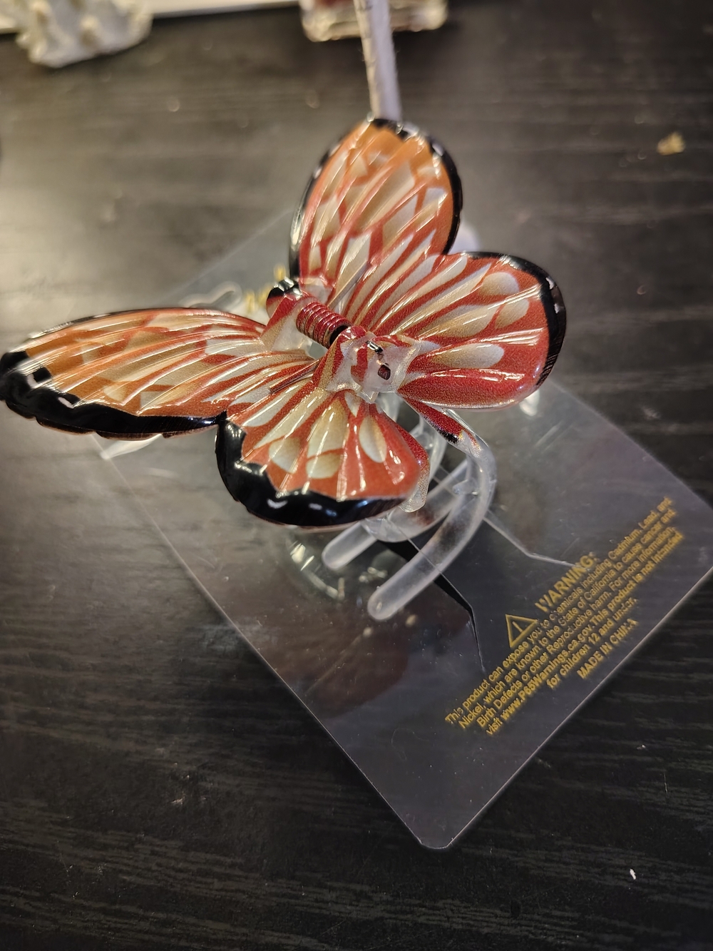 Decorative Orange Butterfly Clip with Black Trim